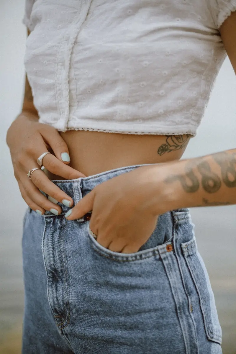 person with tattoo on left arm